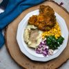 Kentucky Fried Hen of the Woods Soul Food Bowl with mashed potatoes, gravy, greens, and corn