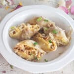 Stuffed pasta shells in a white bowl