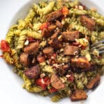 Carrot top pesto pasta with plant based sausgae