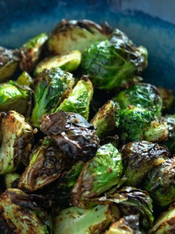 a bowl filled with air fried brussels sprouts