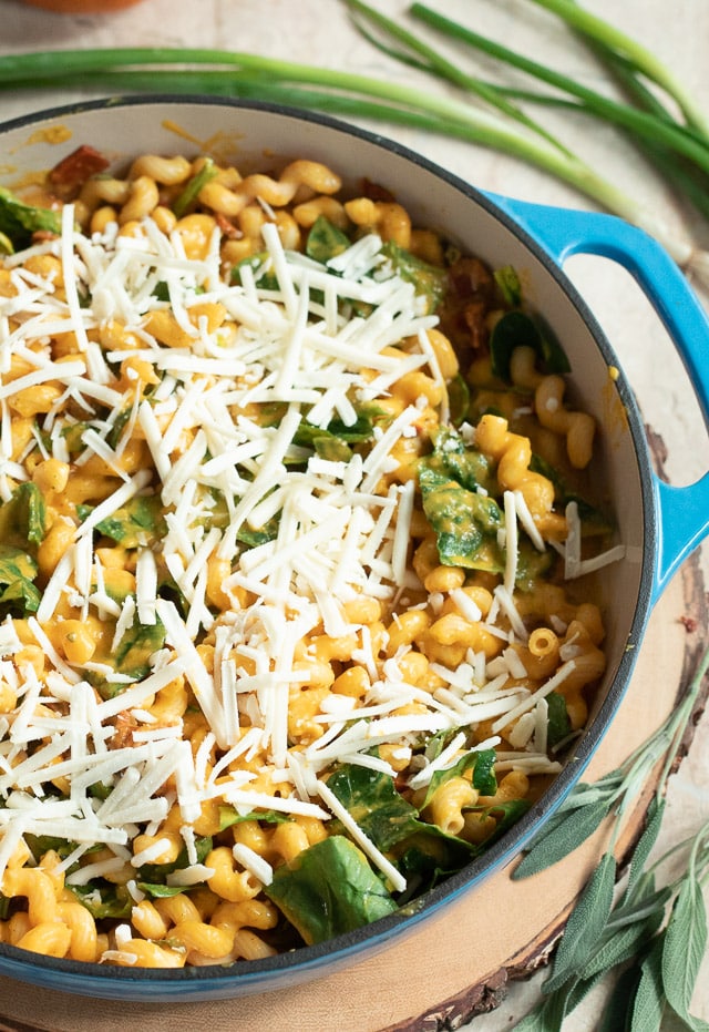 Pumpkin pasta with spinach and cheese waiting to be baked