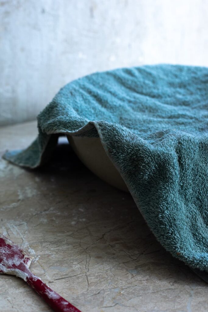 a bowl with a cloth over it