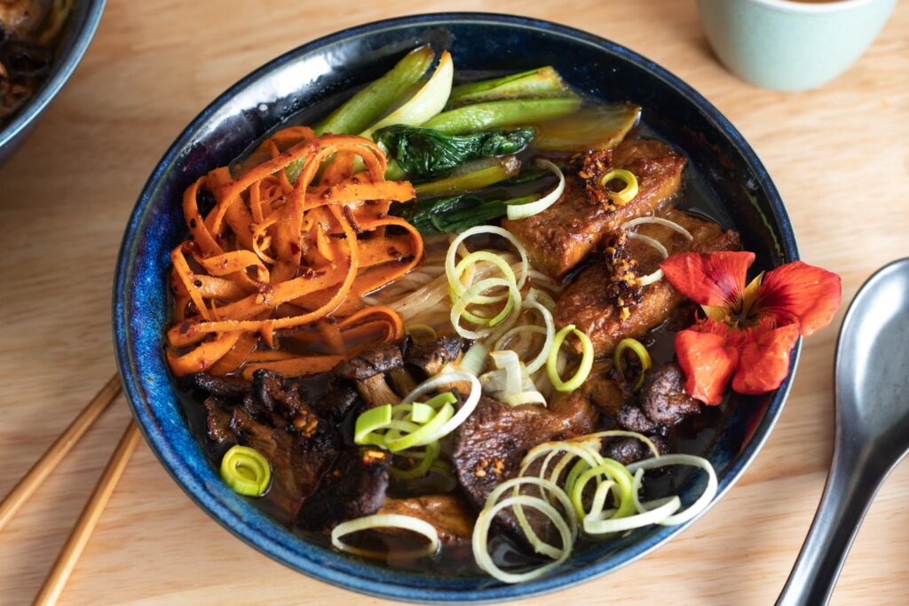 A bowl of ramen loaded with plant based toppings