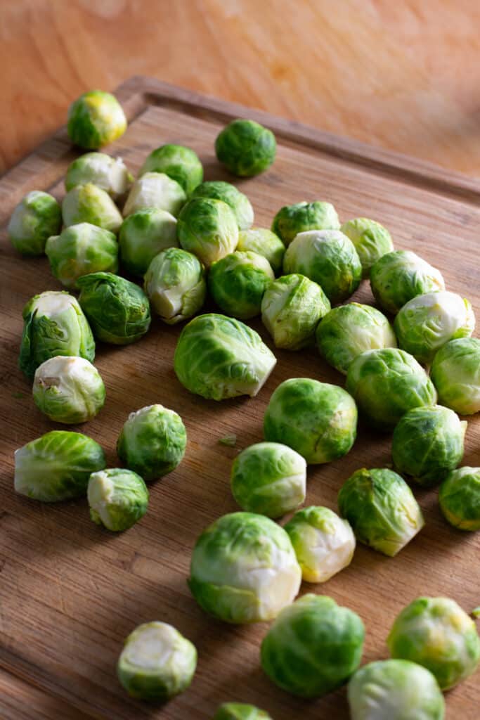 cut brussels sprouts on a cutting board