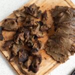 seitan sliced on a wooden cutting board