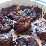 a pan filled with bbq seitan wings