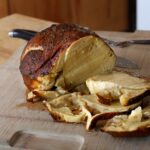 a sliced seitan roast on a cutting board