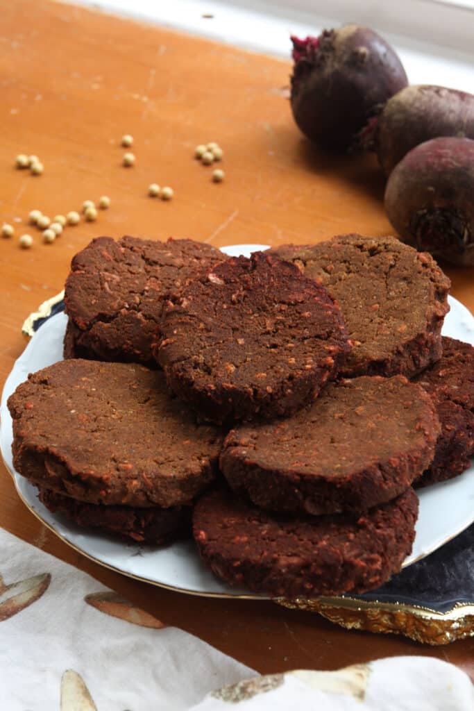 a plate stacked with veggie burgers