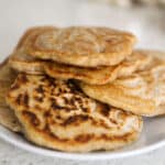 a plate of stacked pancakes